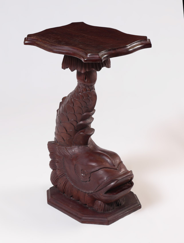 Appraisal: CARVED FIGURAL DOLPHIN PLANT STAND Shaped top carved stylized figural