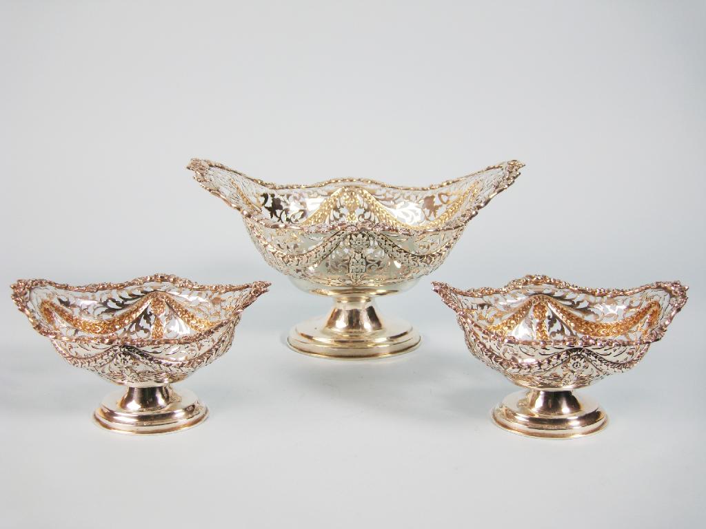 Appraisal: A Suite of three George V pierced oval Baskets with