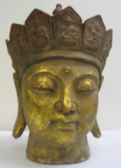 Appraisal: A LATE TH CENTURY CAST METAL HEAD OF BUDDHA with