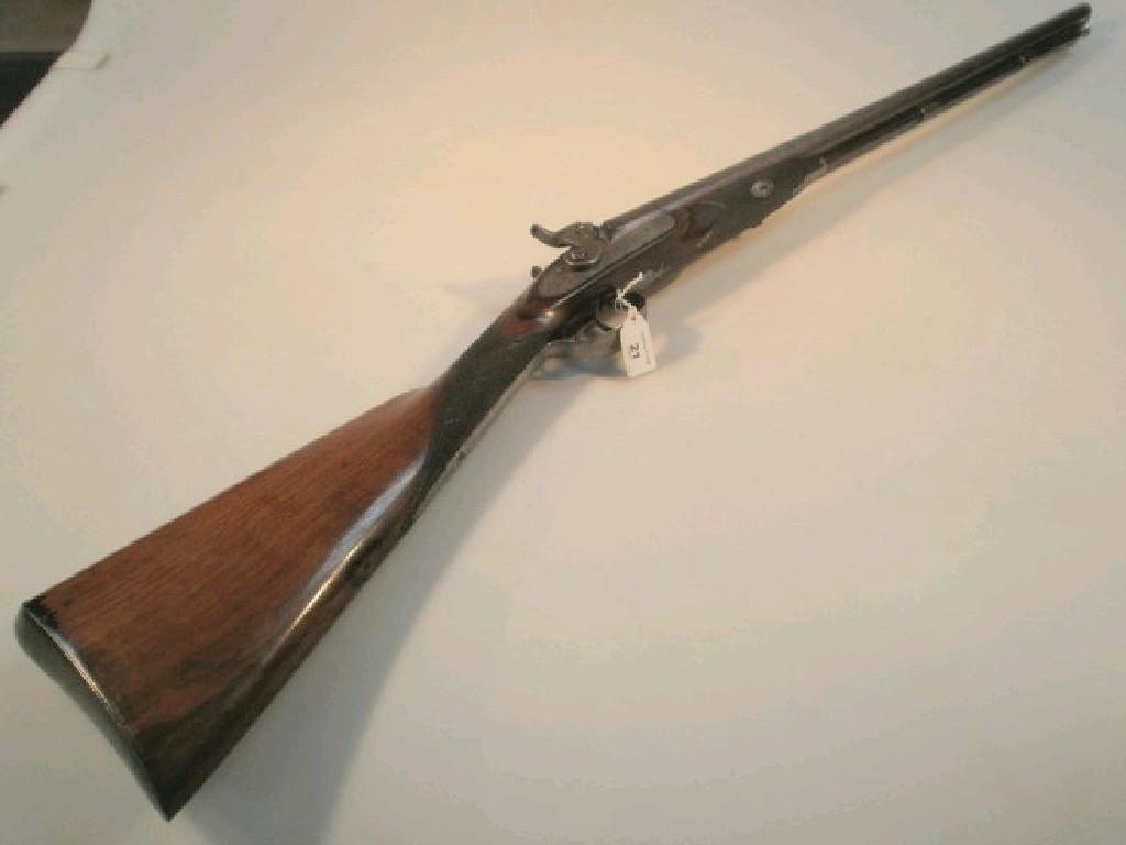 Appraisal: A thC double barrel muzzle loading percussion sporting gun by