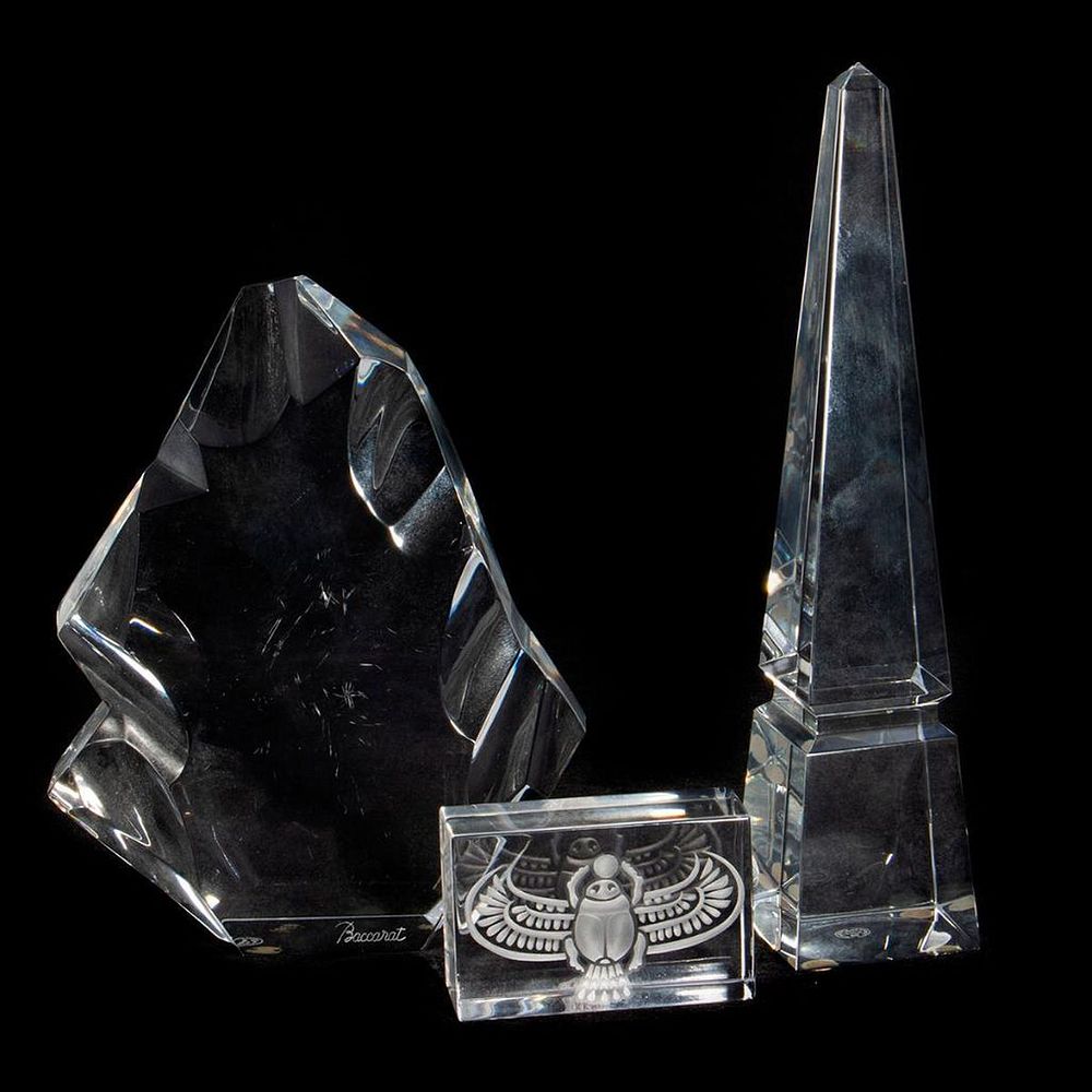 Appraisal: Baccarat Crystal Decorations Including an obelisk a scarabengravedpaperweight and iceberg