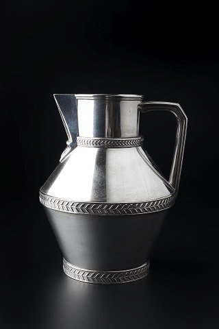 Appraisal: Manner of Christopher Dresser British - Silvered metal jugwith foliate