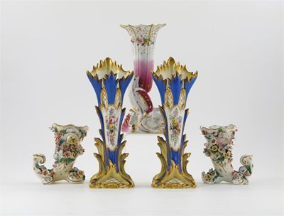 Appraisal: A pair of cornucopia-shaped vases encrusted with flowers a pair