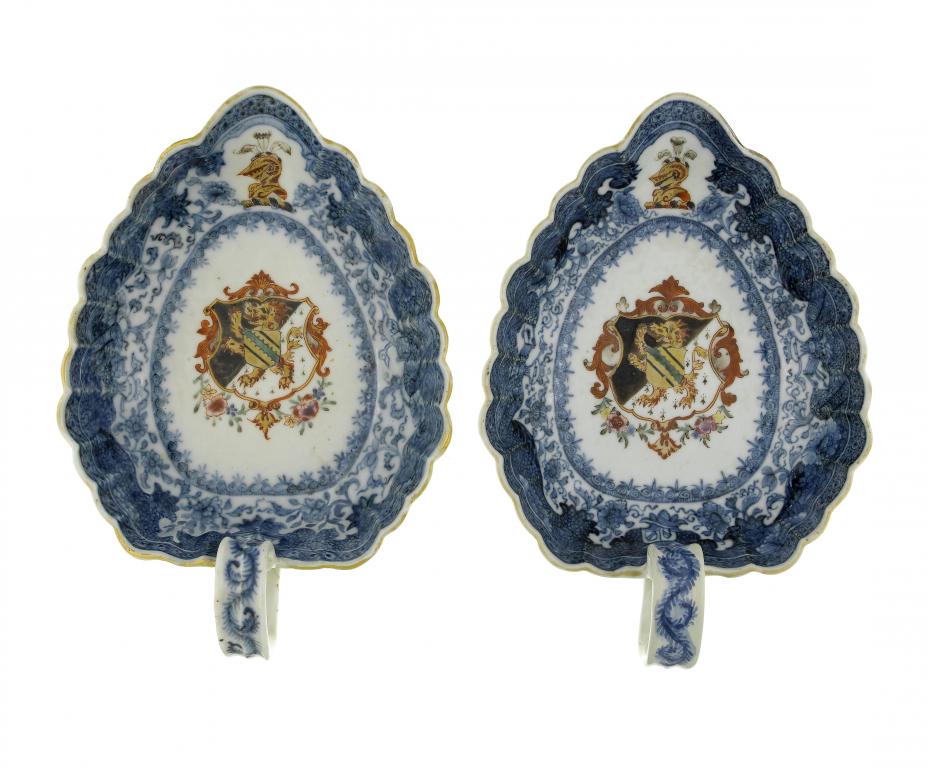 Appraisal: A PAIR OF ARMORIAL SAUCE BOATS of leaf shape enamelled