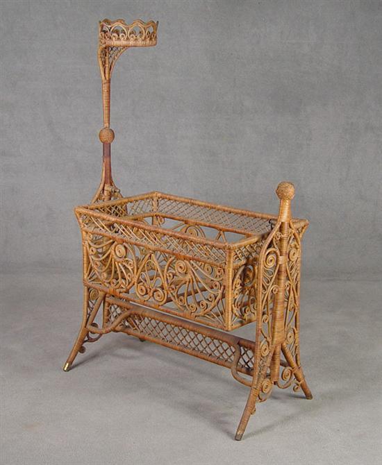 Appraisal: Victorian Wicker Bassinette Circa Crown above swinging bassinette on fancy