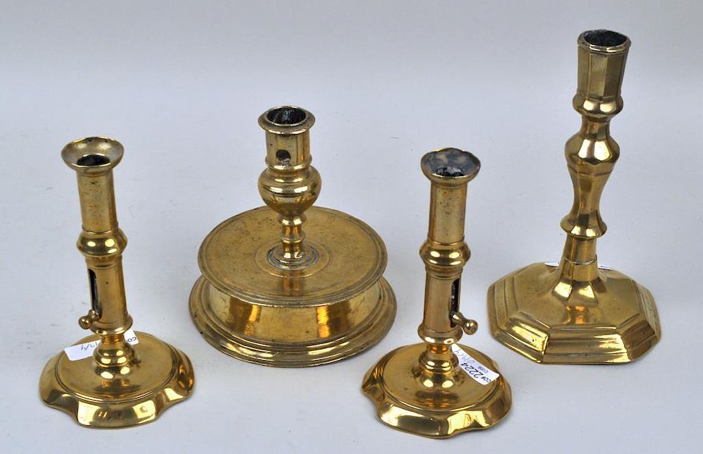 Appraisal: Group Four Period Brass Candlesticks comprising a pair of pushup