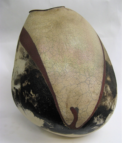 Appraisal: RAKU FIRED POTTERY VESSEL by Michael Gustavson in an egg-shaped