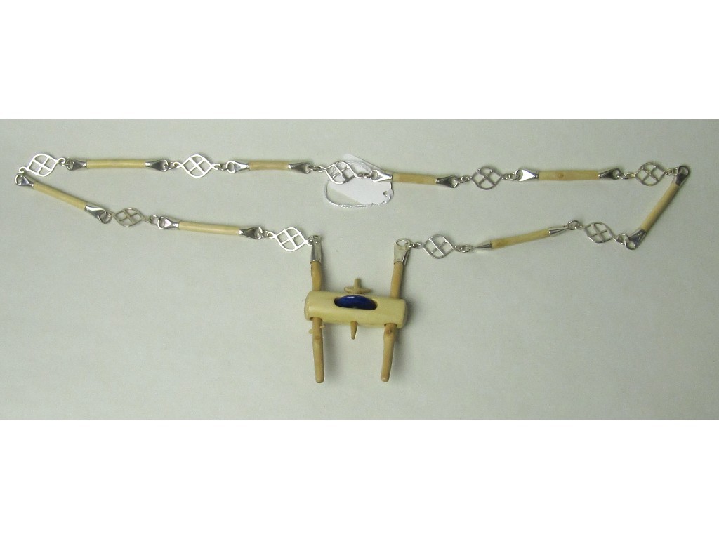 Appraisal: Lot comprising bone and white metal necklet and a similar