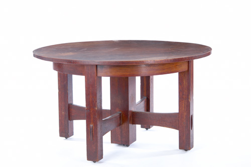 Appraisal: GUSTAV STICKLEY Five-leg dining table with trumpeted cross-stretchers mortised through