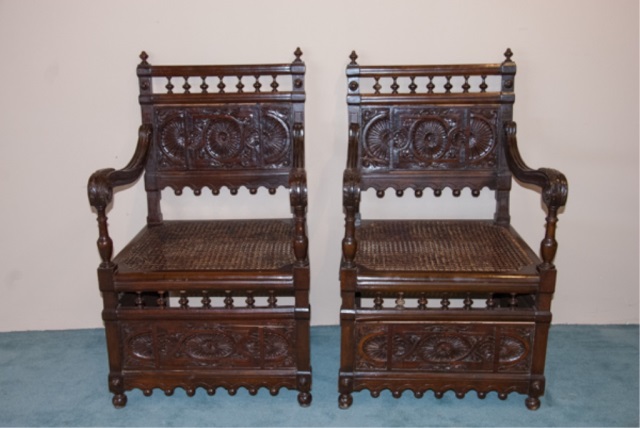 Appraisal: Pair of Heavily Carved Renaissance Revival Chairs Carved panel back