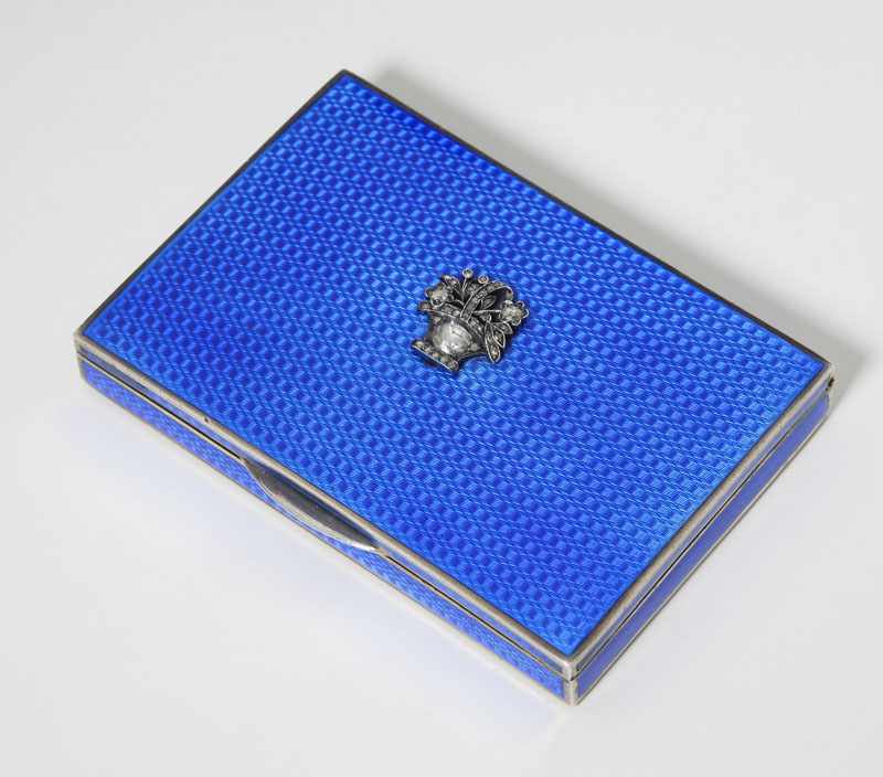 Appraisal: Silver with blue guilloche enamel topped by a silver flower