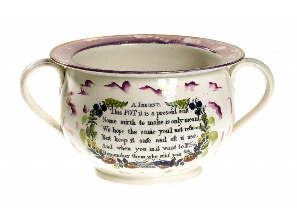 Appraisal: A SUNDERLAND PURPLE MARBLED LUSTRE TWO HANDLED CHAMBER POT 'GARRISON'