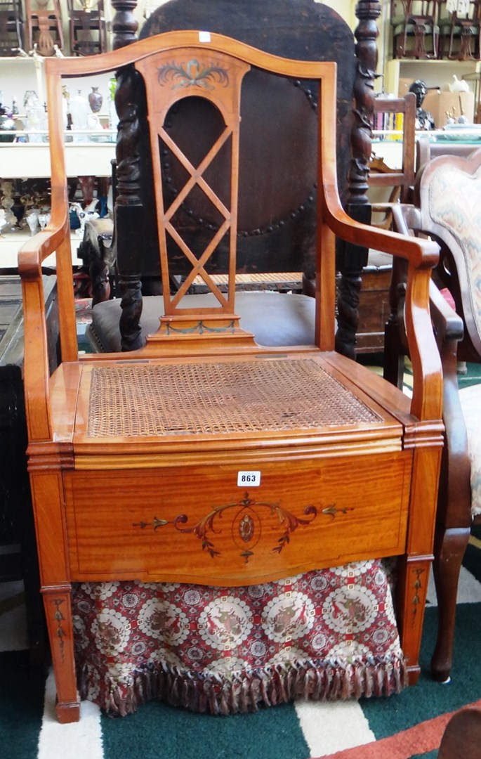 Appraisal: An Edwardian painted satinwood open arm commode chair on tapering