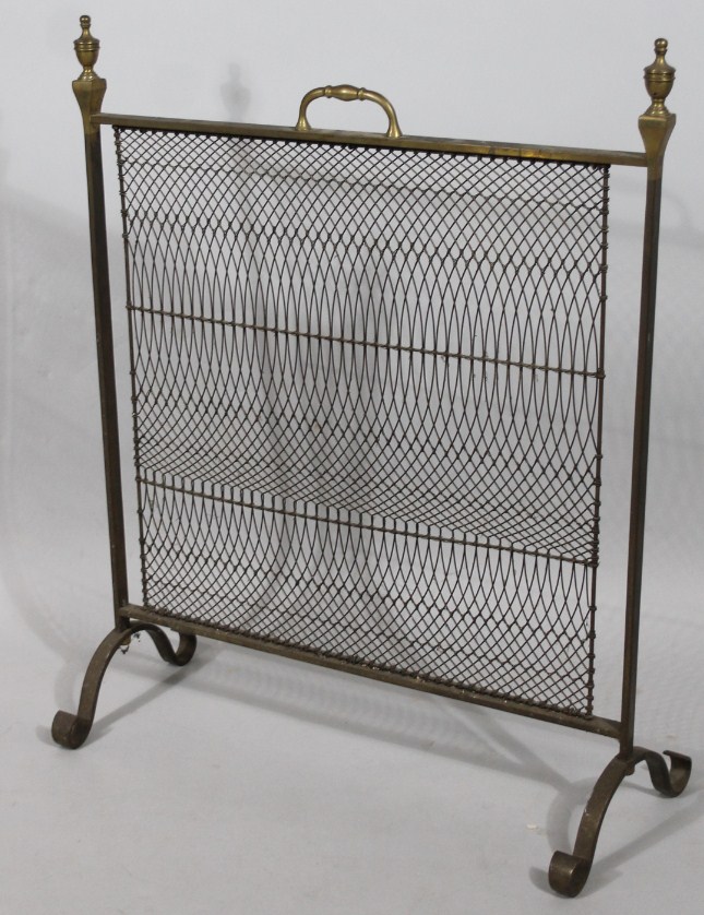 Appraisal: An Edwardian brass fire screen with rectangular outline headed by