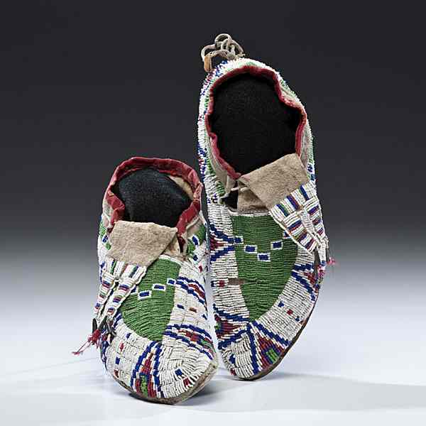 Appraisal: Sioux Beaded Hide Moccasins sinew-sewn and beaded using colors of