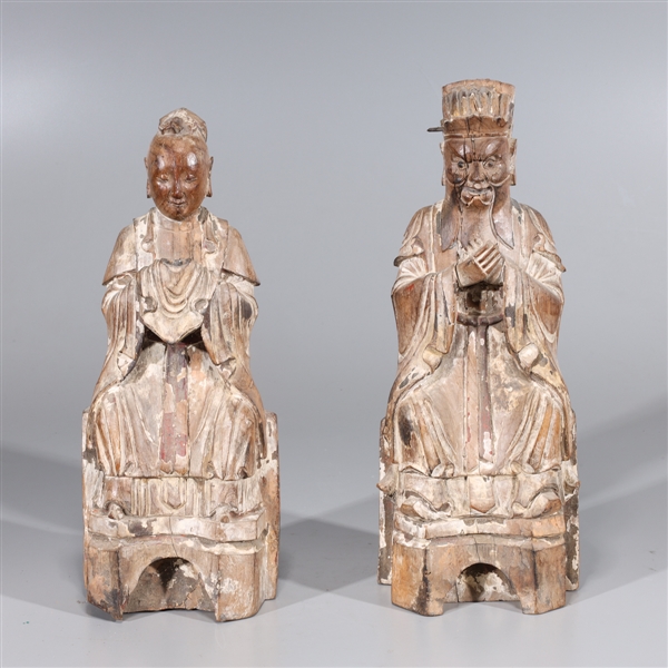 Appraisal: Pair of Chinese carved wood figures including seated emperor and