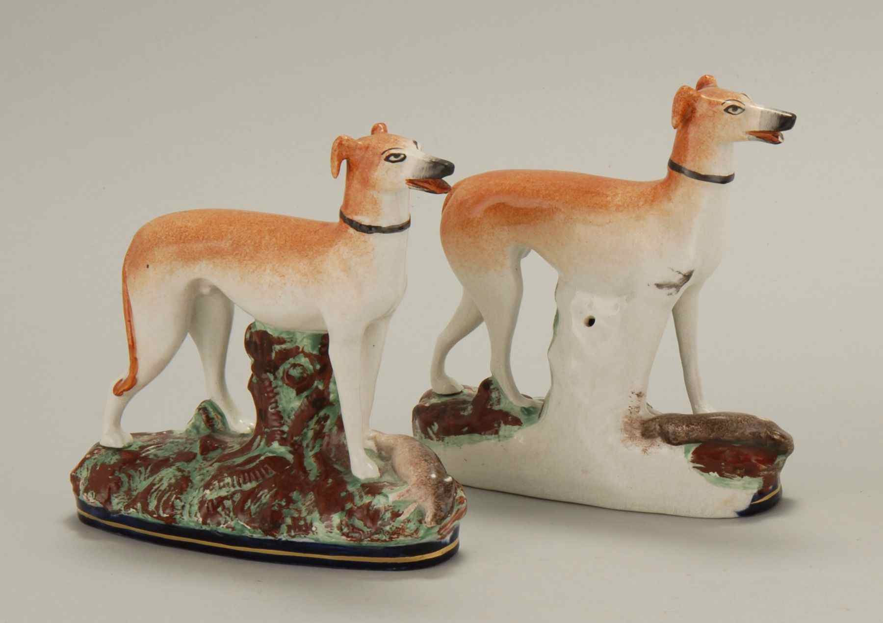 Appraisal: PAIR OF ANTIQUE STAFFORDSHIRE WHIPPET-FORM BOOKENDS th CenturyHeight Length ''