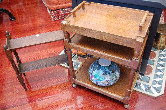 Appraisal: AN OAK MAGAZINE RACK AND AN AUTO TROLLEY