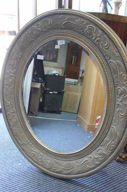 Appraisal: A GREY PAINTED AND PARCEL GILT FRAMED OVAL WALL MIRROR