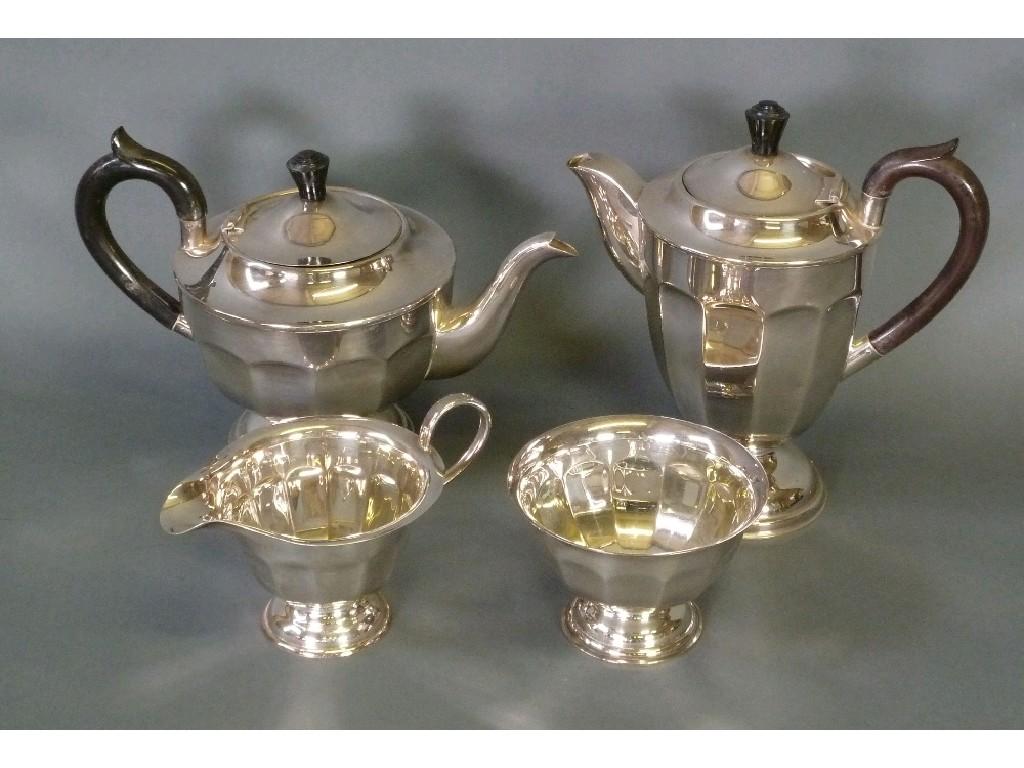 Appraisal: FOUR PIECE ELECTROPLATED PEDESTAL TEA SET circular part panelled form