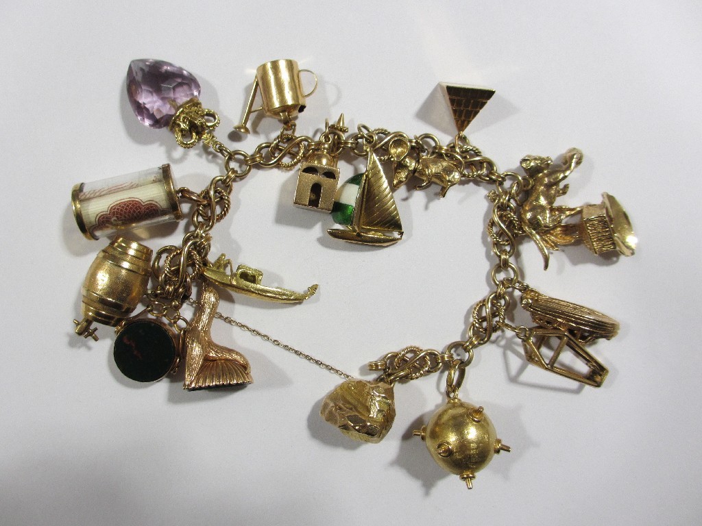 Appraisal: Nine carat gold charm bracelet with various gold charms to