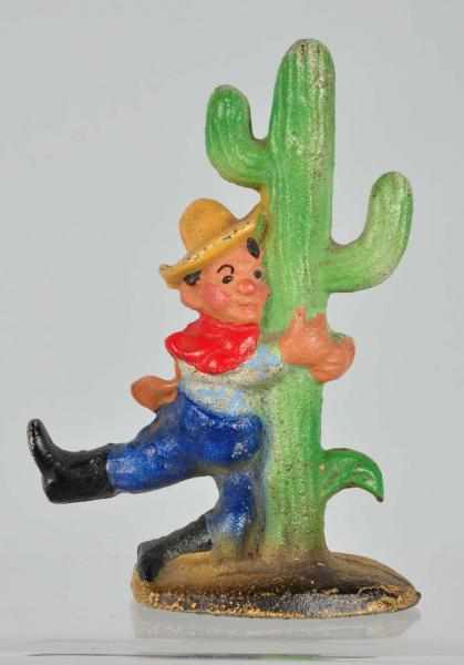 Appraisal: Cast Iron Cowboy by Cactus Bottle Opener Description Manufactured by