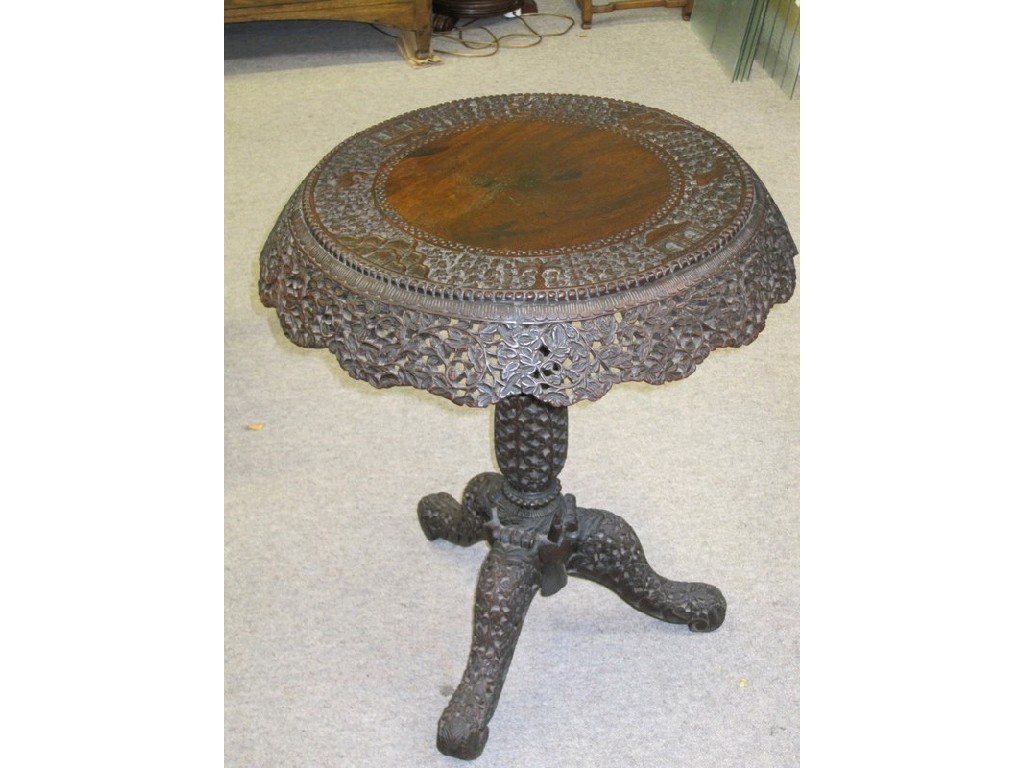 Appraisal: Burmese carved hard wood pedestal table