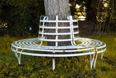 Appraisal: A wrought iron circular slatted tree seat cm diameter