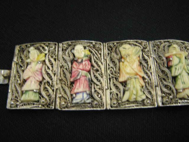 Appraisal: Carved Ivory Sterling Silver Bracelet eight polychromed figures in elaborate