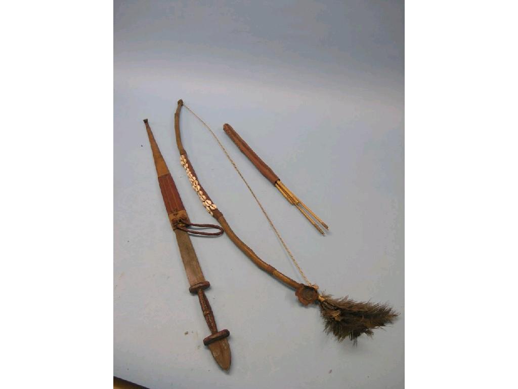 Appraisal: A quantity of Nigerian material including a bow with quiver