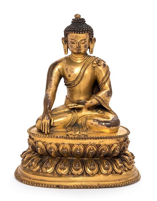 Appraisal: A Sino-Tibetan Gilt Bronze Figure of Shakyamuni Buddha Height inches