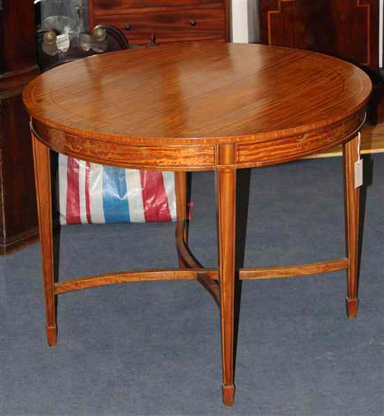 Appraisal: An Edwardian inlaid satinwood circular centre table on square tapered