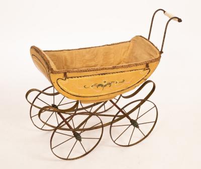 Appraisal: A child's Victorian doll's pram with porcelain handle cm wide