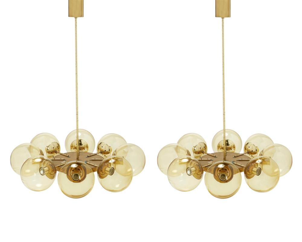 Appraisal: A pair of mid-century modern brass globe chandeliers Mid- th