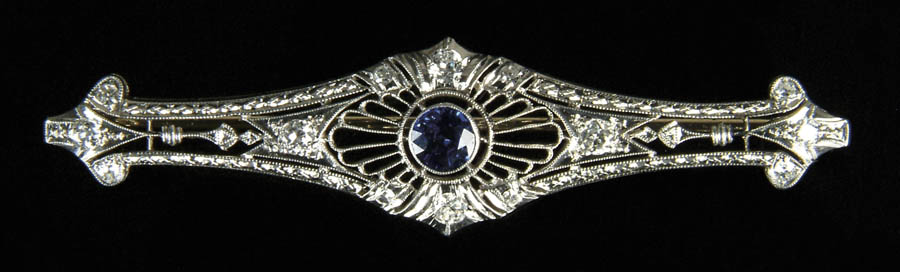 Appraisal: DIAMOND BLUE SAPPHIRE AND PLATINUM BROOCH Platinum filigree brooch centered