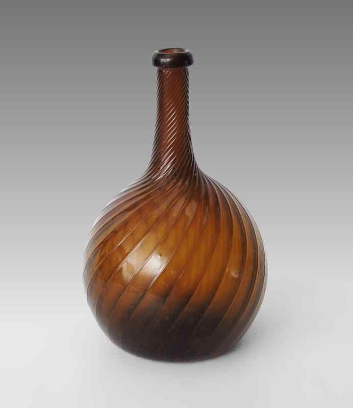 Appraisal: ZANESVILLE AMBER BLOWN GLOBULAR BOTTLE rib with right twist deep