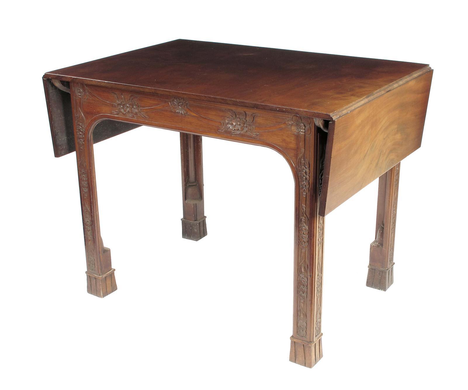 Appraisal: A carved mahogany serving table