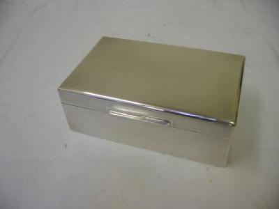 Appraisal: A CIGARETTE BOX of oblong form the whole engine turned