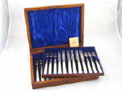 Appraisal: A boxed set of twelve silver dessert knives and forks