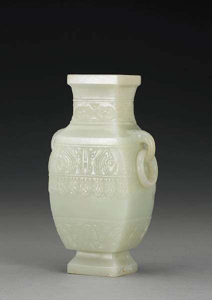 Appraisal: A carved white jade zun-form vase with ring handles th