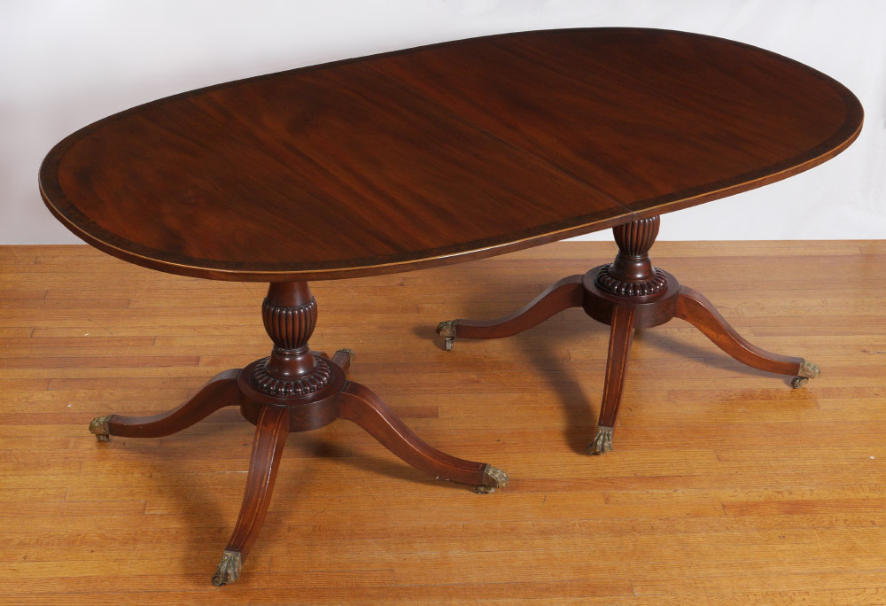 Appraisal: BANDED MAHOGANY DOUBLE PEDESTAL BANQUET DINING TABLE Banded mahogany top