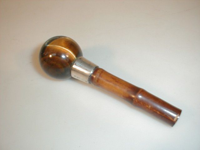 Appraisal: A dandy cane handle with tigers eye spherical knop and