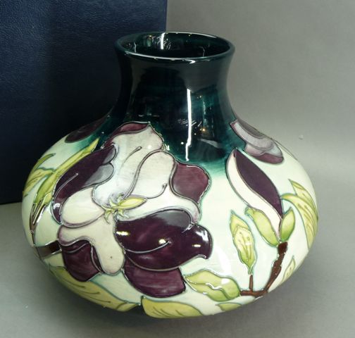 Appraisal: A squat ovoid vase with cylindrical neck and flared rim