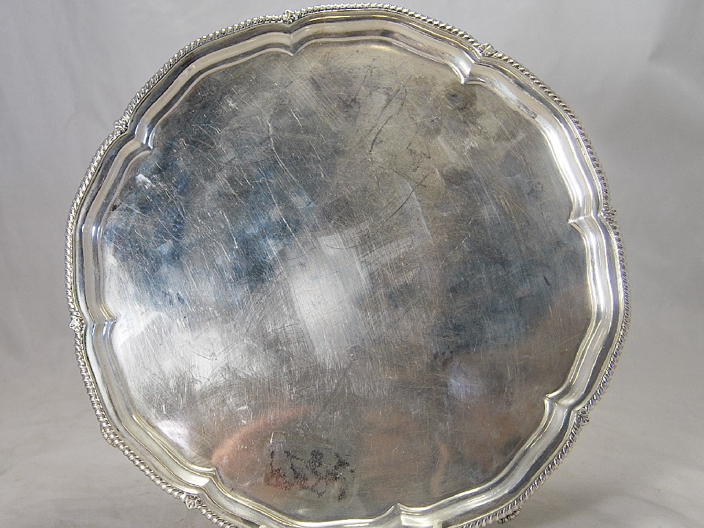 Appraisal: Gadroon edged cm diameter salver on four scroll feet London