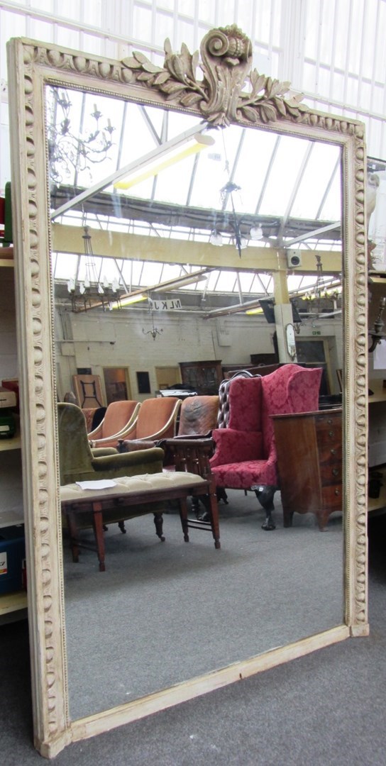 Appraisal: A th century grey painted overmantel mirror with cartouche scroll