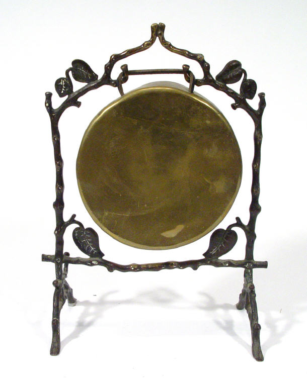 Appraisal: Naturalistic bronze framed dinner gong with hanging brass gong cm