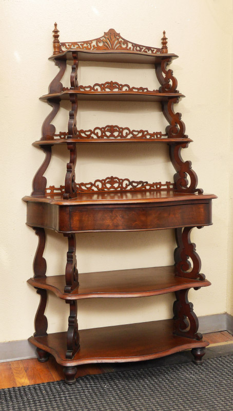 Appraisal: VICTORIAN SERPENTINE ETAGERE graduated serpentine shelves with carved and pierced