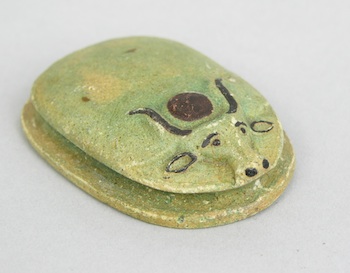 Appraisal: A Faience Scarab A faience scarab with recent pigments rubbed