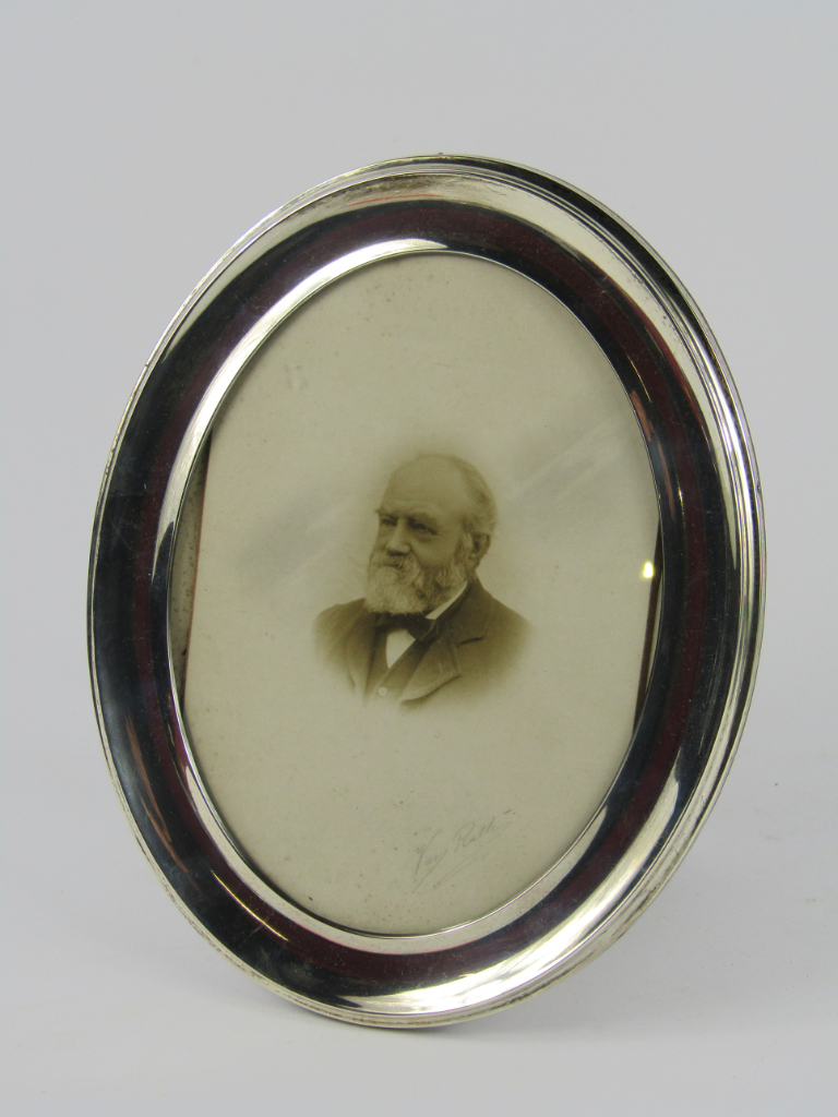 Appraisal: A George V oval silver strut photograph frame Birmingham cm