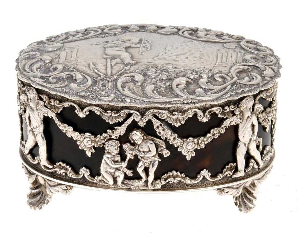 Appraisal: A GEORGE V OVAL TRINKET BOX the scalloped lid embossed